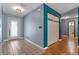 Spacious entryway featuring tile flooring, closet, and a decorative glass front door at 32589 Greenwood Loop, Wesley Chapel, FL 33545