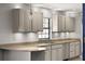 Kitchen featuring granite countertops, stainless steel appliances, and ample cabinet space at 32589 Greenwood Loop, Wesley Chapel, FL 33545