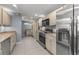 Spacious kitchen with stainless steel appliances, granite countertops, and lots of storage at 32589 Greenwood Loop, Wesley Chapel, FL 33545