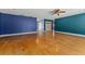 Bright living room with hardwood floors, ample space, and a view of other rooms at 32589 Greenwood Loop, Wesley Chapel, FL 33545