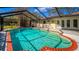 Screened-in pool features brick trim and lots of space for swimming, offering a relaxing outdoor experience at 32589 Greenwood Loop, Wesley Chapel, FL 33545