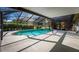 The screened-in pool offers a relaxing oasis with an expansive patio area at 32589 Greenwood Loop, Wesley Chapel, FL 33545