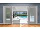 View from inside showcasing the beautiful screened-in pool and patio area at 32589 Greenwood Loop, Wesley Chapel, FL 33545