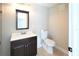 Bright bathroom with a toilet, dark wood vanity, and a toilet at 10952 61St Ave, Seminole, FL 33772