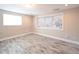 Inviting bedroom featuring a large window with blinds and tile flooring at 10952 61St Ave, Seminole, FL 33772