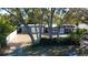 A lovely exterior view of home showcasing the landscaping, driveway, and welcoming facade at 10952 61St Ave, Seminole, FL 33772
