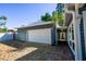 Side view of detached garage, showing access to the yard and brick pathway to house at 10952 61St Ave, Seminole, FL 33772
