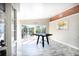 Bright living area with wood-look floors, a sliding glass door to the outdoors, and stylish accents at 10952 61St Ave, Seminole, FL 33772