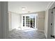 Bright living room featuring tiled floors and large French doors that bring the outside in at 10952 61St Ave, Seminole, FL 33772