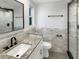 Modern bathroom with granite countertops, subway tile accents, and glass shower enclosure at 523 Red Mangrove Ln, Apollo Beach, FL 33572