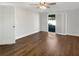 Light and airy bedroom featuring updated flooring, neutral paint, and sliding door access to the lanai at 523 Red Mangrove Ln, Apollo Beach, FL 33572