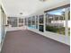 Enclosed lanai with a view of the pool and backyard at 523 Red Mangrove Ln, Apollo Beach, FL 33572