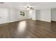 A spacious, bright living room features attractive floors and a ceiling fan at 523 Red Mangrove Ln, Apollo Beach, FL 33572