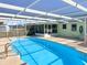Inviting screened-in pool with spacious deck, perfect for outdoor relaxation and entertaining at 523 Red Mangrove Ln, Apollo Beach, FL 33572