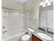 Bathroom featuring a tub-shower combo and a granite-topped vanity with a sleek, modern faucet at 5485 Sunset Falls Dr, Apollo Beach, FL 33572