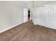 Bedroom with carpet floors, closet, and an open door frame at 5485 Sunset Falls Dr, Apollo Beach, FL 33572