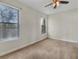 An empty bedroom featuring windows with blinds, a ceiling fan, and carpeted floors at 5485 Sunset Falls Dr, Apollo Beach, FL 33572
