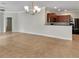 Open living room and kitchen area featuring tile flooring and a chandelier at 5485 Sunset Falls Dr, Apollo Beach, FL 33572