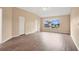 Bedroom with vaulted ceiling, wood flooring, and a bright window at 10809 Sailbrooke Dr, Riverview, FL 33579