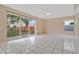 Bright living room with sliding glass doors and white tile flooring at 10809 Sailbrooke Dr, Riverview, FL 33579