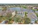 Aerial view showcasing a home in a lakeside community setting at 15121 Searobbin Dr, Lakewood Ranch, FL 34202
