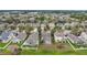 Aerial view displays the home's location in a community with nearby pond at 15121 Searobbin Dr, Lakewood Ranch, FL 34202