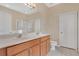 Bright bathroom featuring double sinks, a soaking tub, and a separate glass shower at 15121 Searobbin Dr, Lakewood Ranch, FL 34202