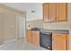 Well-equipped kitchen offers wooden cabinetry, modern appliances, and durable countertops at 15121 Searobbin Dr, Lakewood Ranch, FL 34202