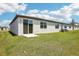 Spacious backyard with a grassy area, perfect for outdoor activities and relaxation at 31610 Malbec Dr, Brooksville, FL 34602