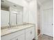 Elegant bathroom with double vanity, granite countertop, and walk-in shower at 31610 Malbec Dr, Brooksville, FL 34602