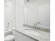 Bright bathroom with a shower-tub, granite counters, and white cabinets at 31610 Malbec Dr, Brooksville, FL 34602