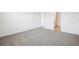 Spacious carpeted bedroom with neutral walls, offering a blank canvas for personalization at 31610 Malbec Dr, Brooksville, FL 34602