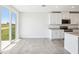 Bright kitchen showcases granite countertops and stainless steel appliances with a view to the yard at 31610 Malbec Dr, Brooksville, FL 34602