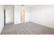 Airy bedroom with soft carpet and a doorway to the bathroom, offering comfort and convenience at 31632 Malbec Dr, Brooksville, FL 34602