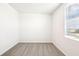 The bedroom features neutral carpet, white walls, and a window at 31632 Malbec Dr, Brooksville, FL 34602