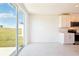 This is a kitchen featuring white cabinets, stainless steel appliances, and outdoor views at 31632 Malbec Dr, Brooksville, FL 34602