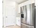 Stylish kitchen with stainless steel refrigerator and white cabinets, offering a sleek and functional design at 31632 Malbec Dr, Brooksville, FL 34602