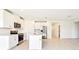 This kitchen has stainless steel appliances, a kitchen island, and white cabinets at 31632 Malbec Dr, Brooksville, FL 34602
