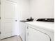 Neat laundry room with modern washer and dryer units, ready for use at 31632 Malbec Dr, Brooksville, FL 34602