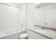 The bathroom features a tub, toilet, sink and a granite countertop at 31668 Wild Grape Ln, Brooksville, FL 34602
