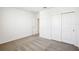 This is a secondary bedroom with carpeted floors, a closet and white walls at 31668 Wild Grape Ln, Brooksville, FL 34602