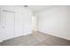 A secondary bedroom with carpet, and a closet at 31668 Wild Grape Ln, Brooksville, FL 34602