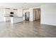 Spacious open-concept layout with a large kitchen island and modern stainless steel appliances at 31668 Wild Grape Ln, Brooksville, FL 34602