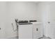 Laundry room with white washer and dryer at 31681 Wild Grape Ln, Brooksville, FL 34602