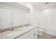Clean bathroom featuring double sinks, granite countertop, and tiled shower at 3553 Moscato Dr, Brooksville, FL 34602