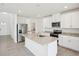 Bright kitchen features stainless steel appliances, granite countertops, and a large island at 3553 Moscato Dr, Brooksville, FL 34602