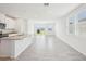 Open-concept living space with tile flooring and ample natural light at 3553 Moscato Dr, Brooksville, FL 34602