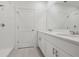 Modern bathroom features double sinks, shower and tub with white tile at 3634 Moscato Dr, Brooksville, FL 34602