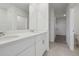 Bright bathroom features double sinks, chrome faucets and door to walk in closet at 3634 Moscato Dr, Brooksville, FL 34602