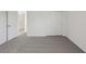Bedroom with an ensuite bathroom, closet with bi-fold doors and neutral carpet at 3634 Moscato Dr, Brooksville, FL 34602